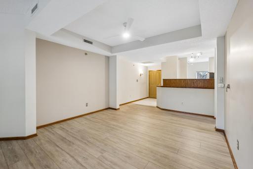 Nuetral, move in ready, with wide plank LVT flooring.