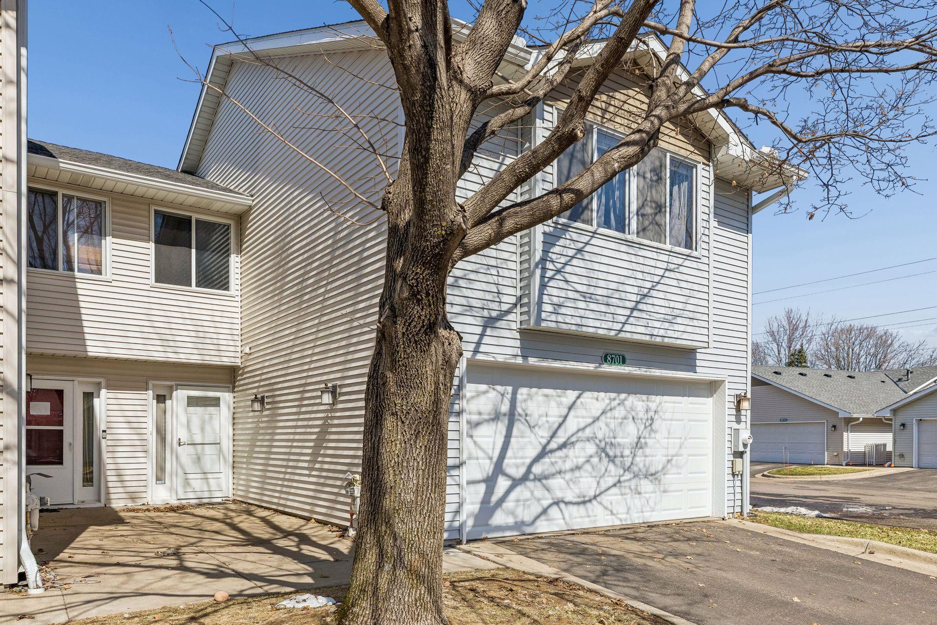 Welcome home to this updated end unit townhome at 8701 Norway St. NW, complete with a new garage door (2023) and thoughtful improvements throughout.