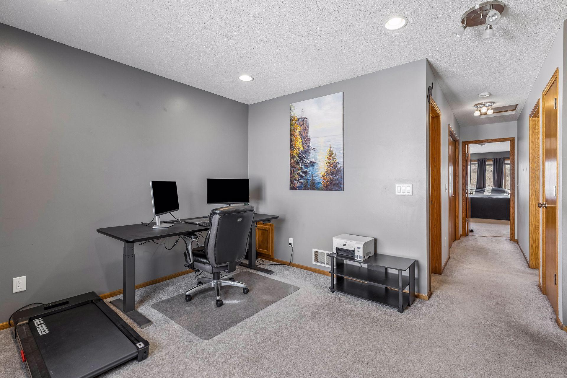 Versatile upper level loft with carpet, recessed lighting, and a double window that fills the space with tons of light.