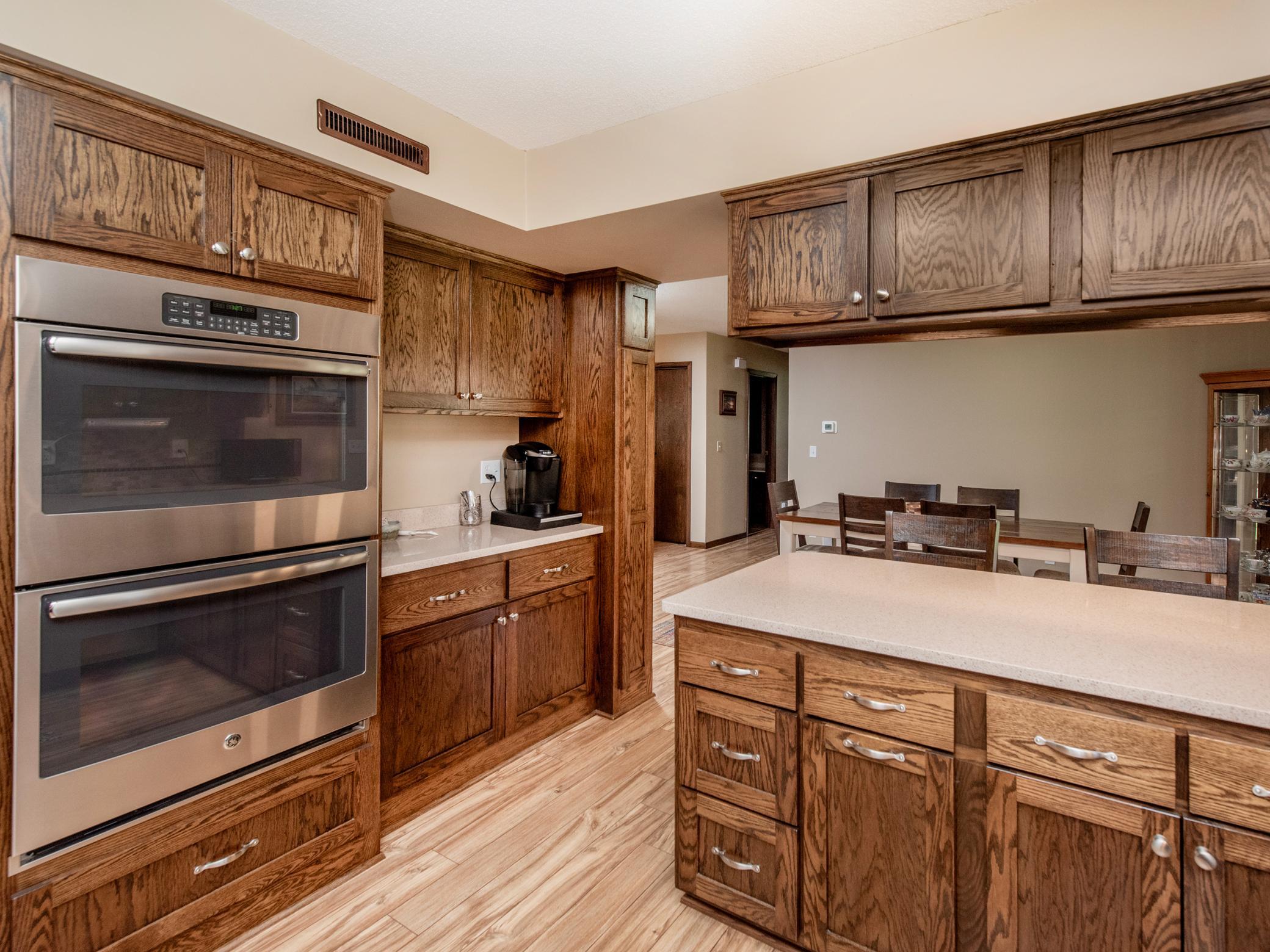 Double ovens. Coffee bar. Updated kitchen with newer pulls and quartz countertops.