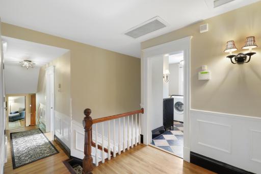 In addition to the primary ensuite, the upper level boasts a full laundry room, two additional bathrooms and four generously sized bedrooms.