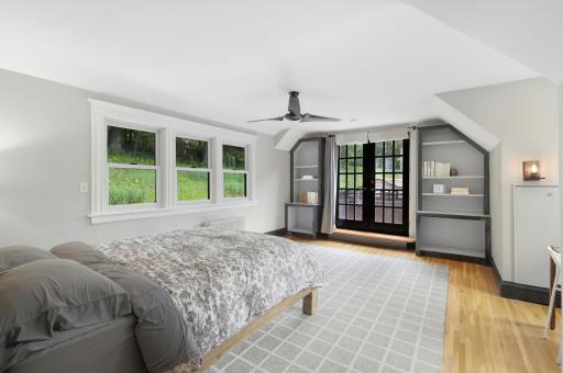 In addition to the primary ensuite, the upper level boasts a full laundry room, two additional bathrooms and four generously sized bedrooms.