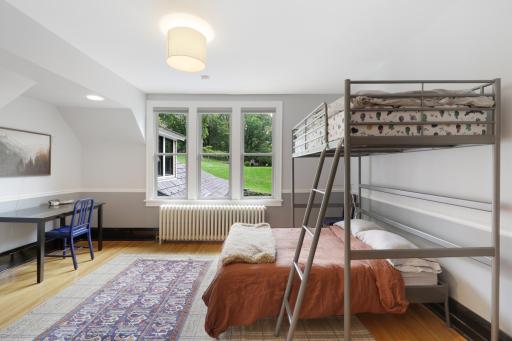 In addition to the primary ensuite, the upper level boasts a full laundry room, two additional bathrooms and four generously sized bedrooms.
