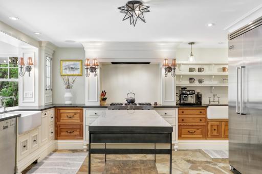 Enjoy cooking and entertaining in your well-appointed chefâs kitchen, which features stone countertops, two farmhouse sinks, Viking appliances, an additional wet bar with a wine fridge, and more.
