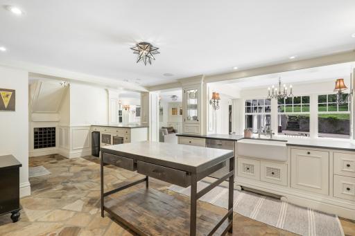 Enjoy cooking and entertaining in your well-appointed chefâs kitchen, which features stone countertops, two farmhouse sinks, Viking appliances, an additional wet bar with a wine fridge, and more.