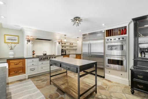 Enjoy cooking and entertaining in your well-appointed chefâs kitchen, which features stone countertops, two farmhouse sinks, Viking appliances, an additional wet bar with a wine fridge, and more.