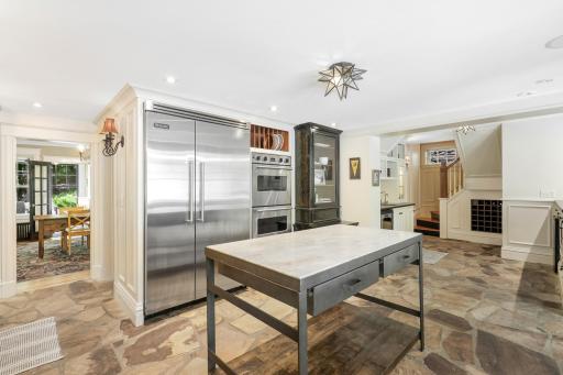 Enjoy cooking and entertaining in your well-appointed chefâs kitchen, which features stone countertops, two farmhouse sinks, Viking appliances, an additional wet bar with a wine fridge, and more.
