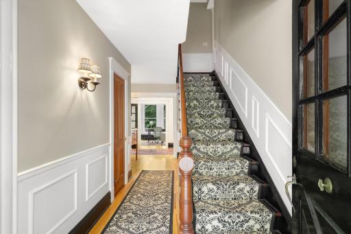 In addition to the primary ensuite, the upper level boasts a full laundry room, two additional bathrooms and four generously sized bedrooms.