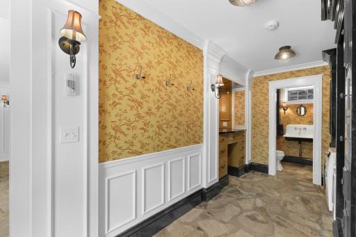 The mudroom, connected to the insulated three-car garage, provides plenty of space to take off shoes and coats, and hosts a convenient, 2nd laundry set up.
