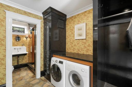 The mudroom, connected to the insulated three-car garage, provides plenty of space to take off shoes and coats, and hosts a convenient, 2nd laundry set up.
