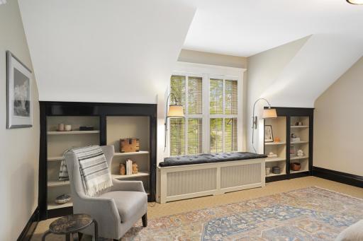 Unwind at the end of the day in the luxurious primary ensuite featuring his and her walk-in closets, a private bathroom with heated tile floors, dual vanities, a freestanding soaking tub, a walk-in shower, and a separate water closet.