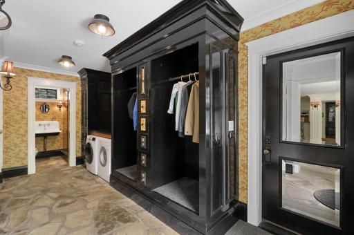 The mudroom, connected to the insulated three-car garage, provides plenty of space to take off shoes and coats, and hosts a convenient, 2nd laundry set up.