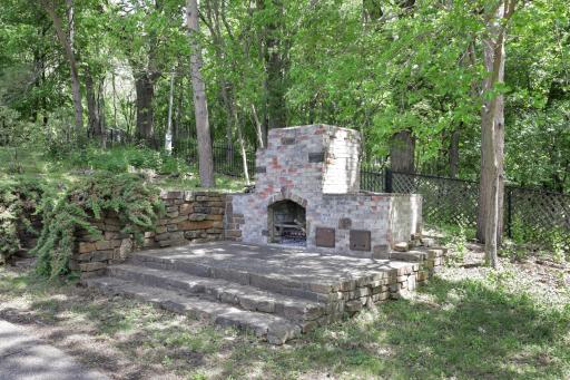 An inground pool area at the SE corner with patios and an outdoor fireplace provides an excellent space to relax and enjoy nature or entertain friends and family.