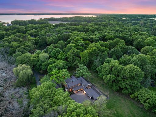 The fully fenced, maturely wooded, resort like estate provides nearly 360 degrees of privacy and ample space for endless outdoor activities.