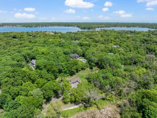 The fully fenced, maturely wooded, resort like estate provides nearly 360 degrees of privacy and ample space for endless outdoor activities.