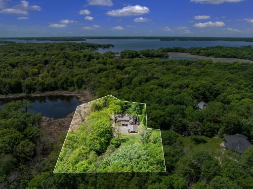 1920s charm meets 2020s luxury in this thoughtfully expanded and restored farmhouse on a private, 2.5-acre, wooded estate, with 360 degree nature views overlooking Shaver Lake.