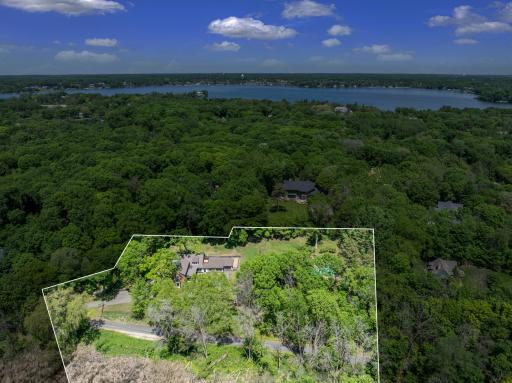 1920s charm meets 2020s luxury in this thoughtfully expanded and restored farmhouse on a private, 2.5-acre, wooded estate, with 360 degree nature views overlooking Shaver Lake.