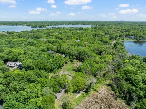 The fully fenced, maturely wooded, resort like estate provides nearly 360 degrees of privacy and ample space for endless outdoor activities.