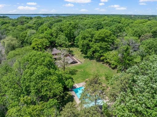 The fully fenced, maturely wooded, resort like estate provides nearly 360 degrees of privacy and ample space for endless outdoor activities.