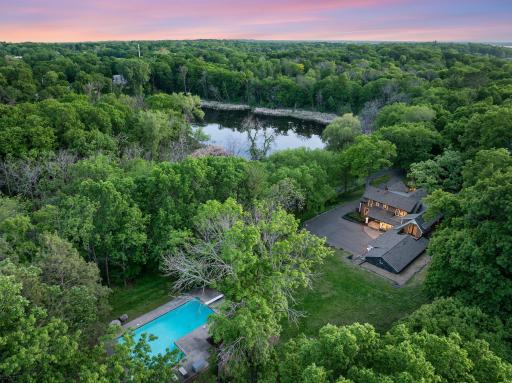 The fully fenced, maturely wooded, resort like estate provides nearly 360 degrees of privacy and ample space for endless outdoor activities.