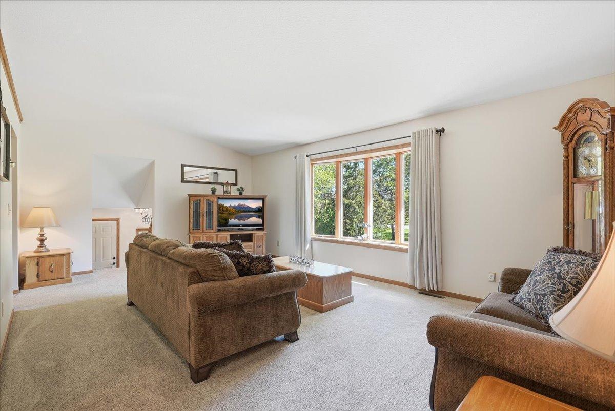 Upper level living room with big bay window for all that natural light to come in.