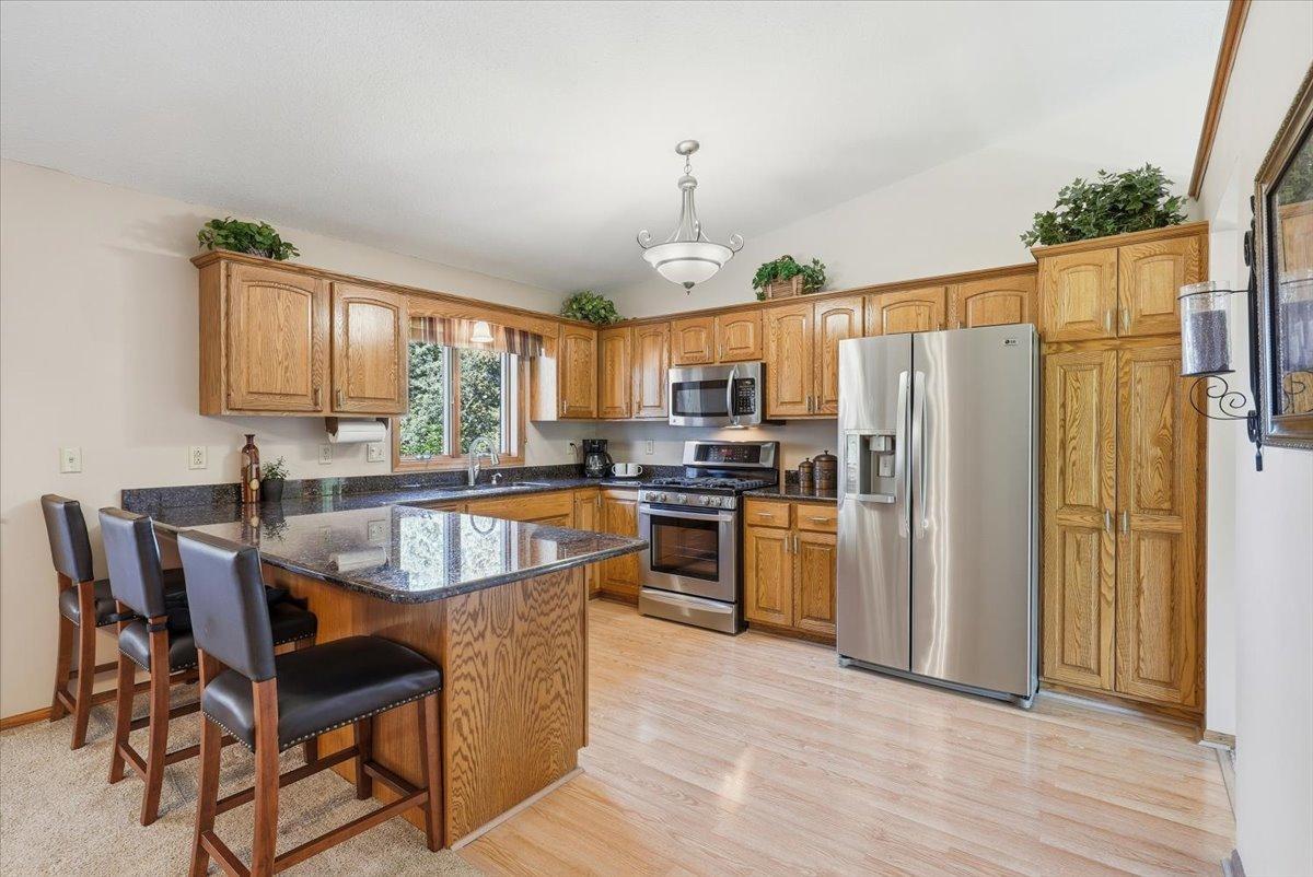 Spacious kitchen with update stainless steel appliances.