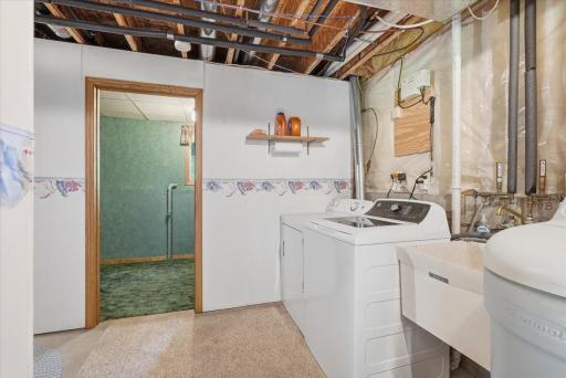 Laundry/Utility room with more space for extra storage.
