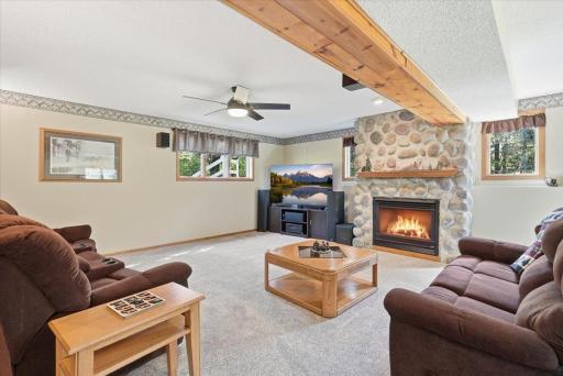 Cozy up to the fireplace in the lower level family room for movie nights.