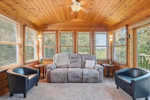 Enjoy morning coffee or reading in your cozy 4 season sunroom.