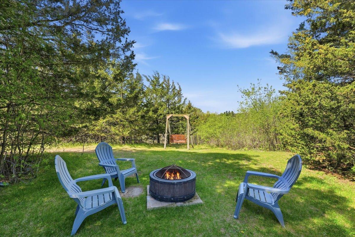 Enjoy cozy campfires in your secluded backyard.