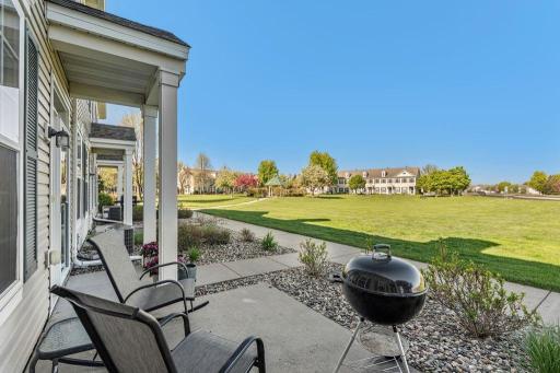 A front porch offers connection with neighbors and loads of green space to enjoy.