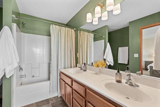 Primary full bathroom with double sinks.
