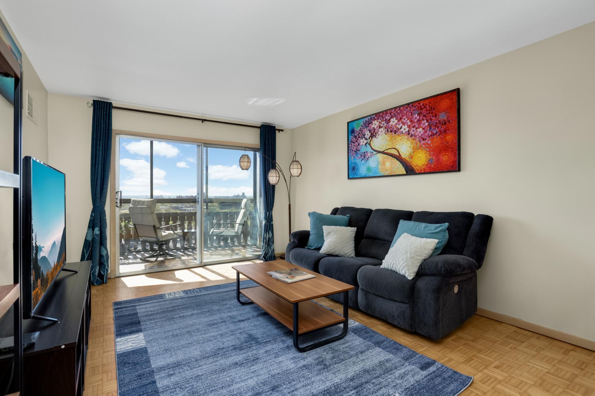 Living room opens to private balcony