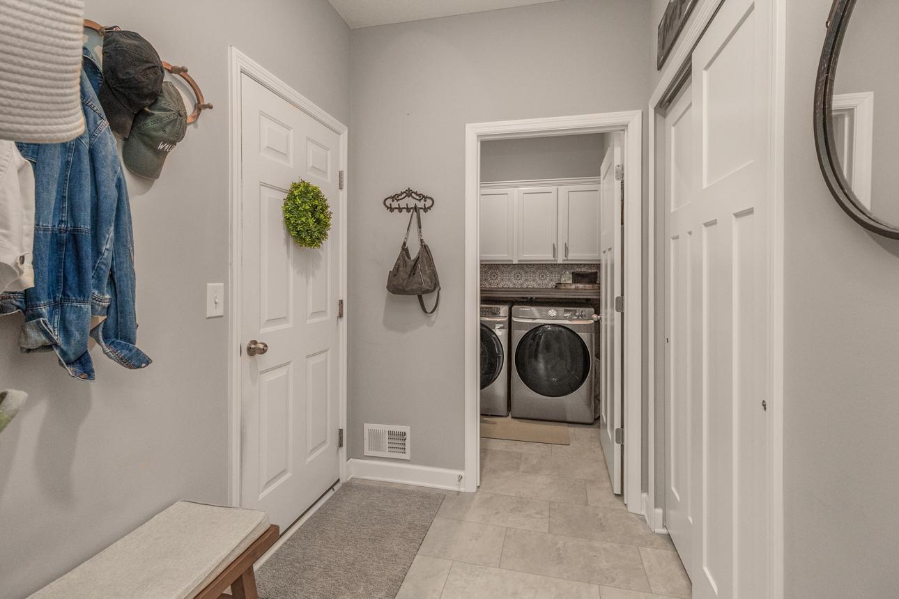 Laundry room & mudroom inside garage entry