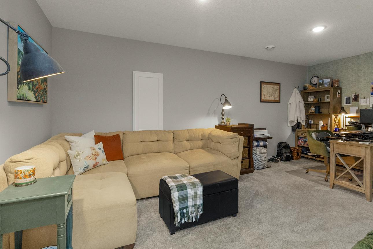 Lower level office has cozy couch space