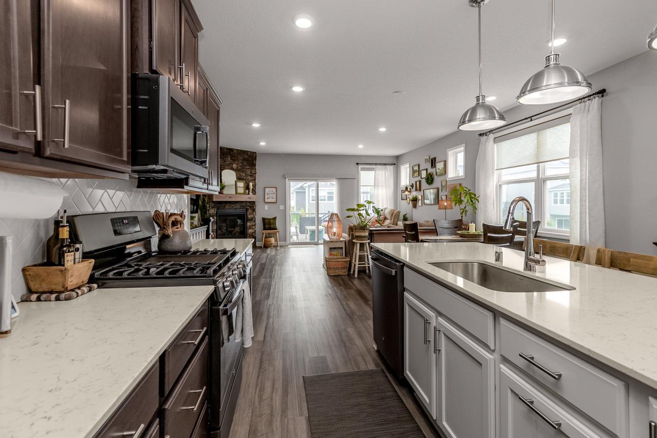 Kitchen opens to living space