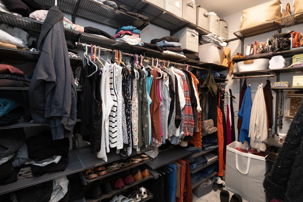 Primary walk-in closet with custom closet system