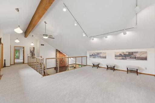 Mezzanine. Catwalk. Loft. Its all here. Primary bedroom suite is an entire level! Walk in closets, custom lighting, private bath, and a loft. Now that's a primary bedroom!