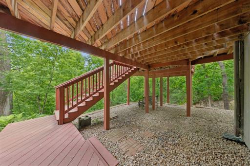 Multi level deck. Sit on the bench and look out at the trees and pond. You will feel at home.