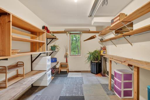 Lower level storage or work room. Could even be made into a sixth bedroom!