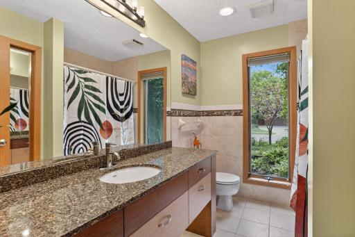 Main level full bathroom! Check out the under cabinet custom lighting!