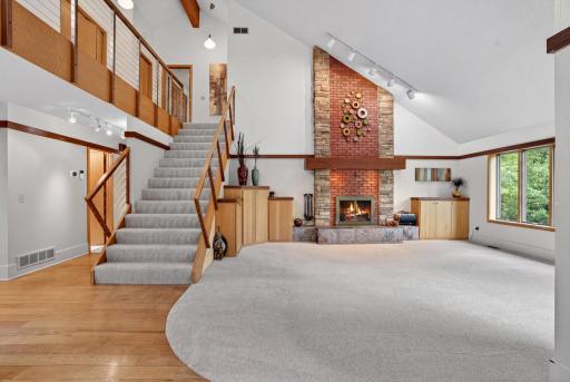 Absolutely gorgeous! Floor to ceiling wood burning fireplace and picture perfect windows. It is like living in a tree top paradise!