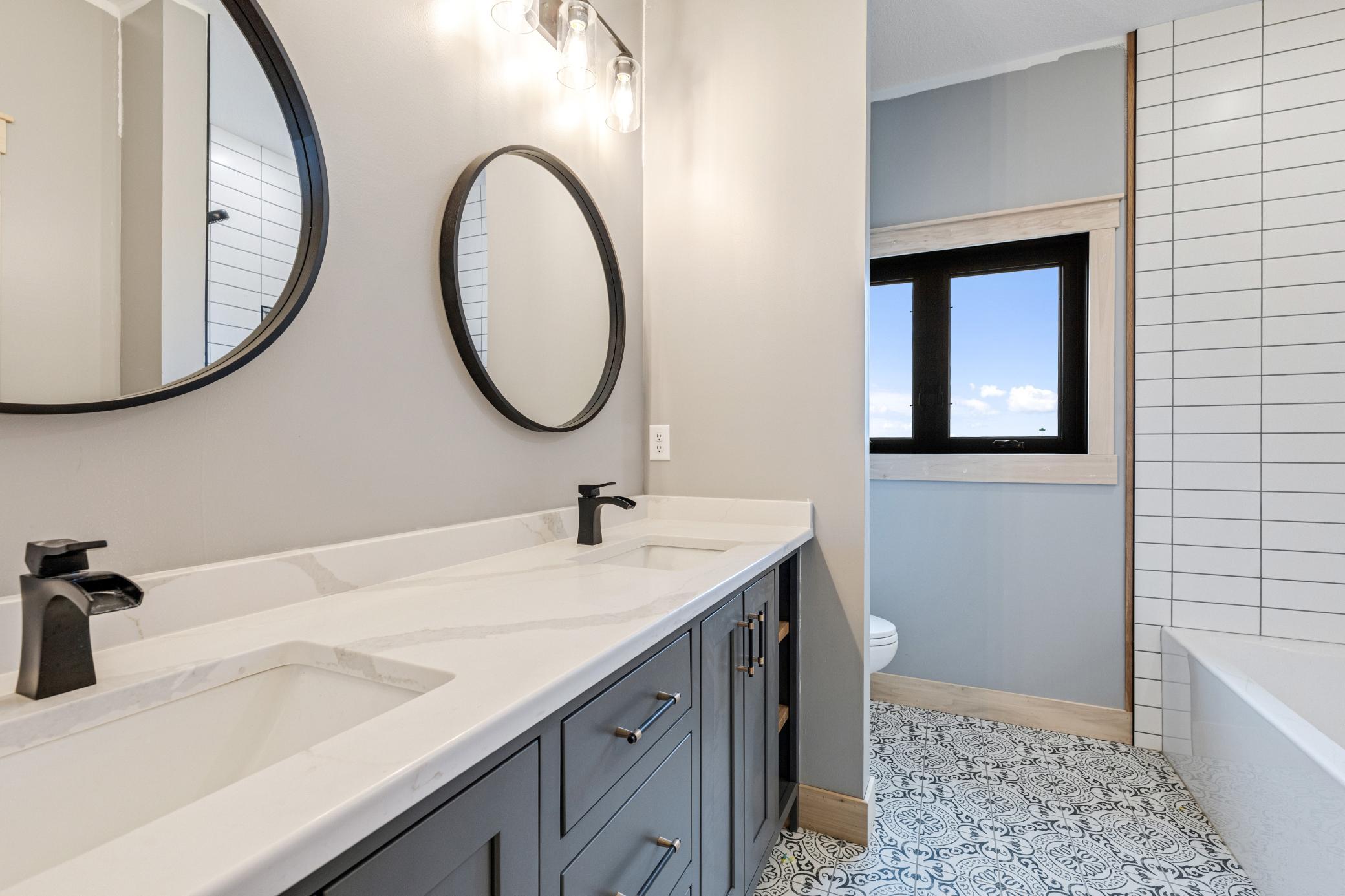 Double sinks/ closet behind door