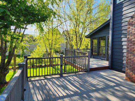 Enjoy this two-tiered maintenance free deck measuring 16x16 and 12x10 conveniently located off the 3 season porch and garage service door.