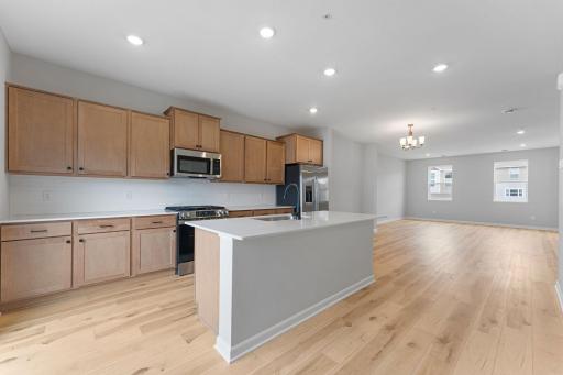 Functional flow and tons of surface space makes cooking and entertaining a breeze. Similar home shown, color and options can vary.