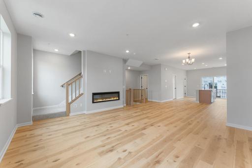 The open concept flows seamlessly from kitchen to family room for easy entertaining. Similar home shown, options can vary.