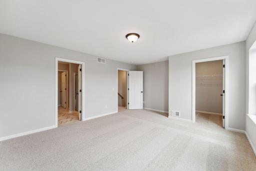 Owner's suite has two walk-in closets! Similar home shown.