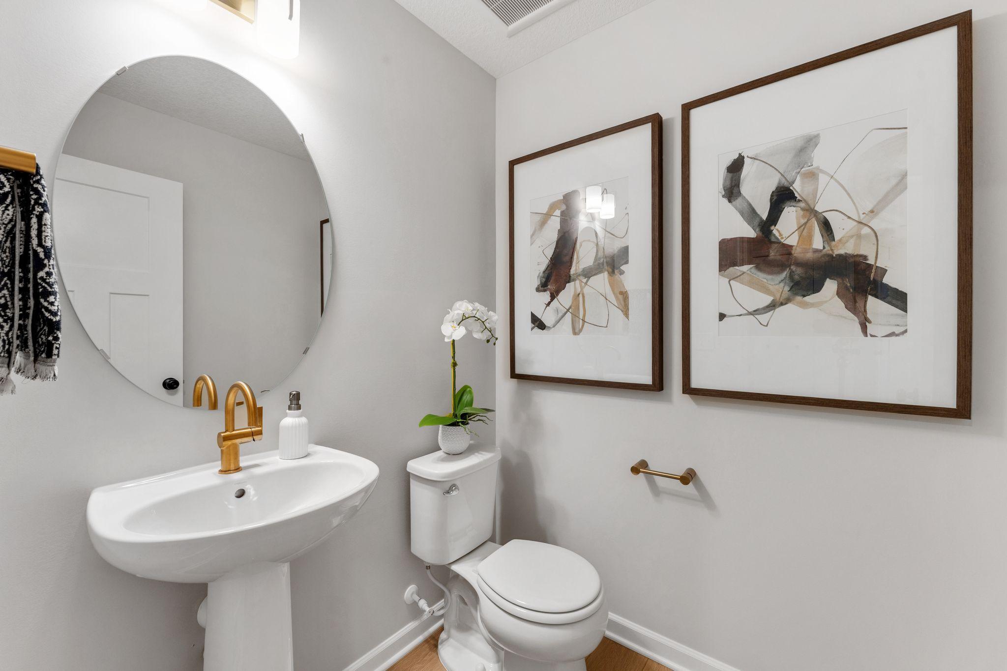 Photo of similar home for reference only. Colors and selections will vary. Kingston floorplan. Charming main level powder room.