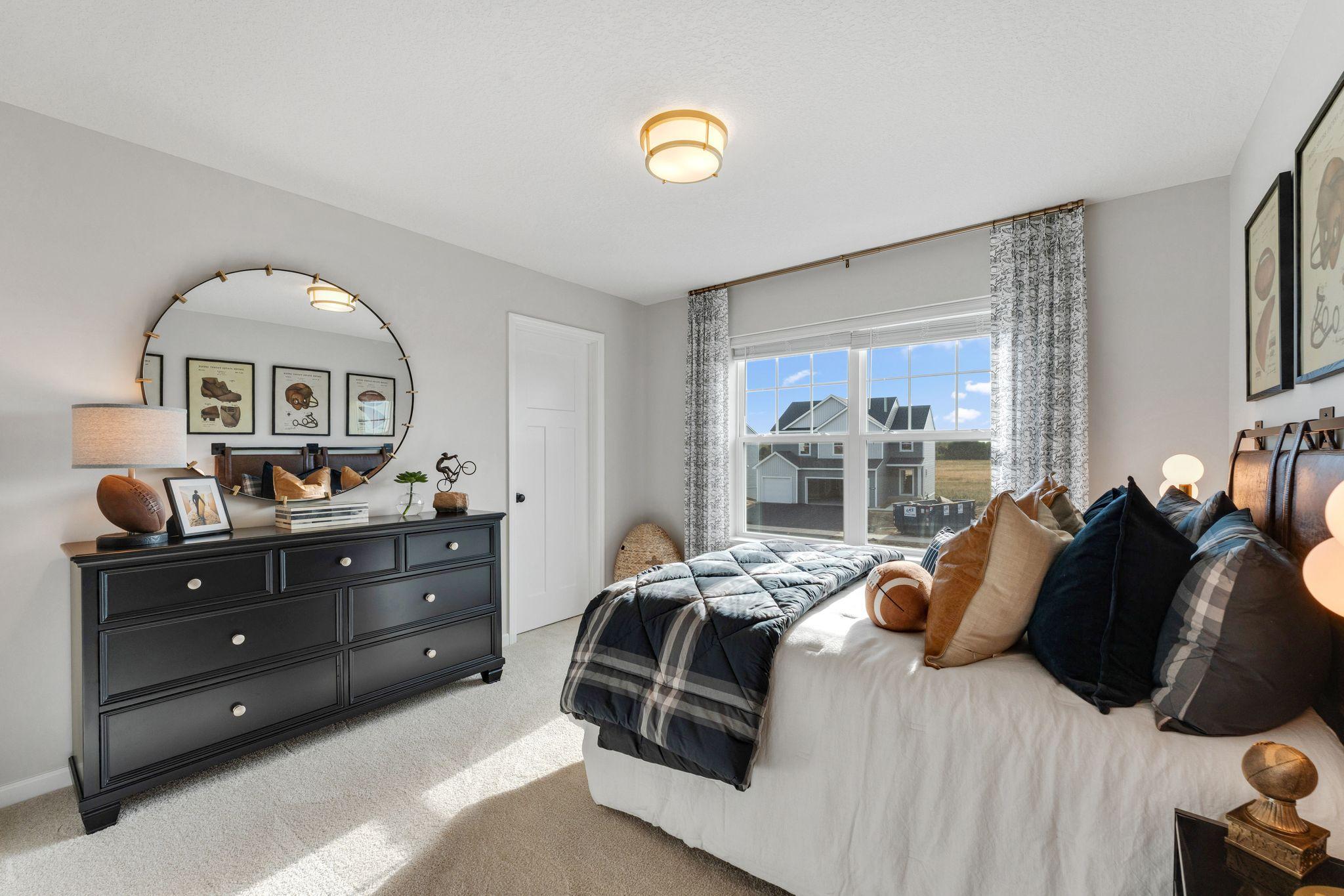 Photo of similar home for reference only. Colors and selections will vary. Kingston floorplan. Upper level bedroom 2.