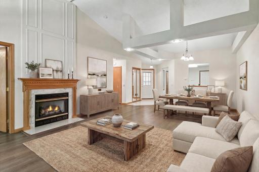 Vaulted great room with open-concept living (Virtually Staged)
